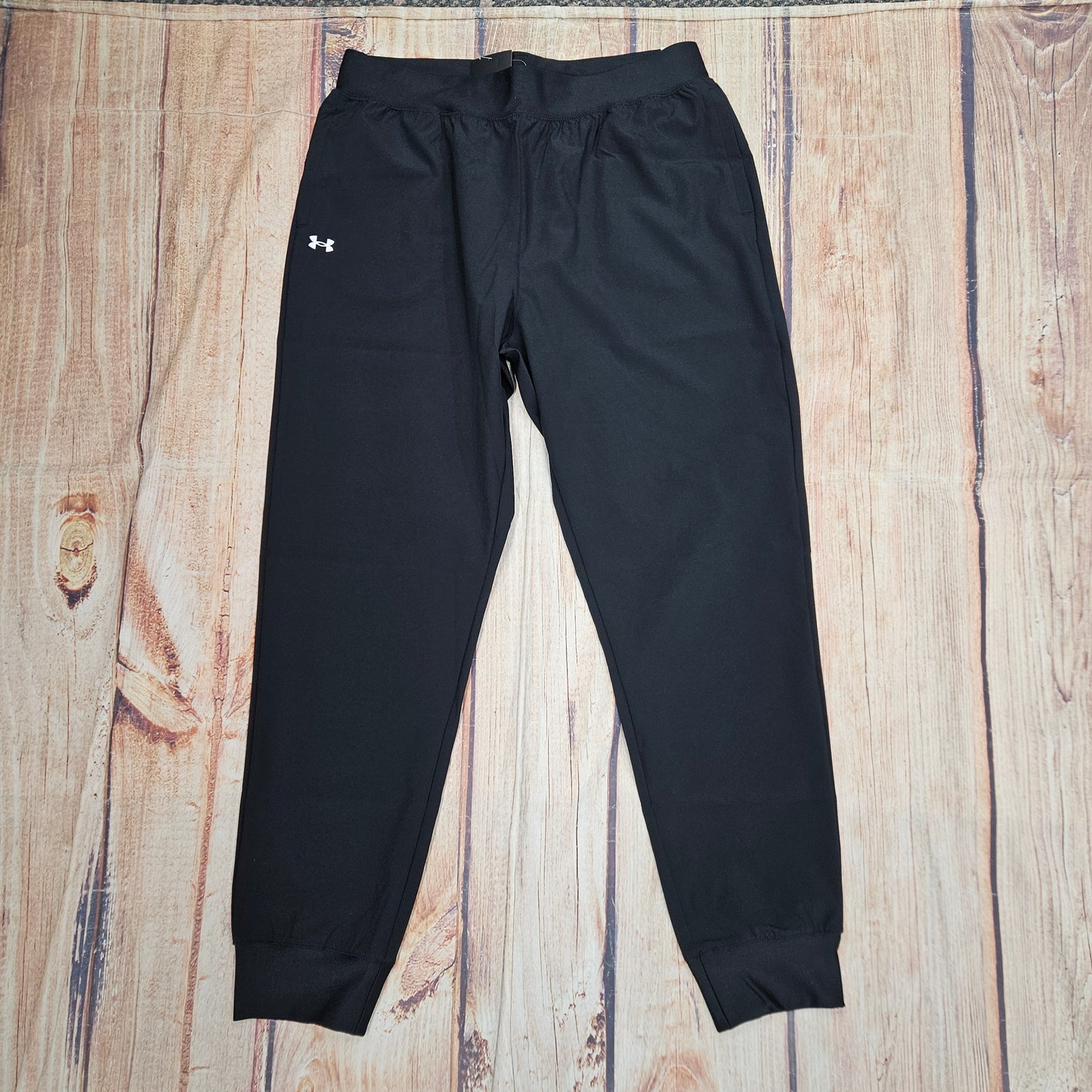 UA WMNS RIVAL HI RISE PANT BLACK 1082727