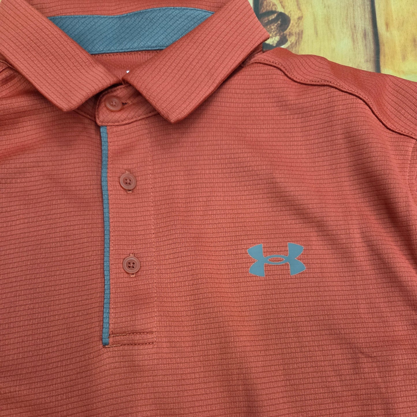 UA MENS TECH BRICK RED POLO 1290140-636
